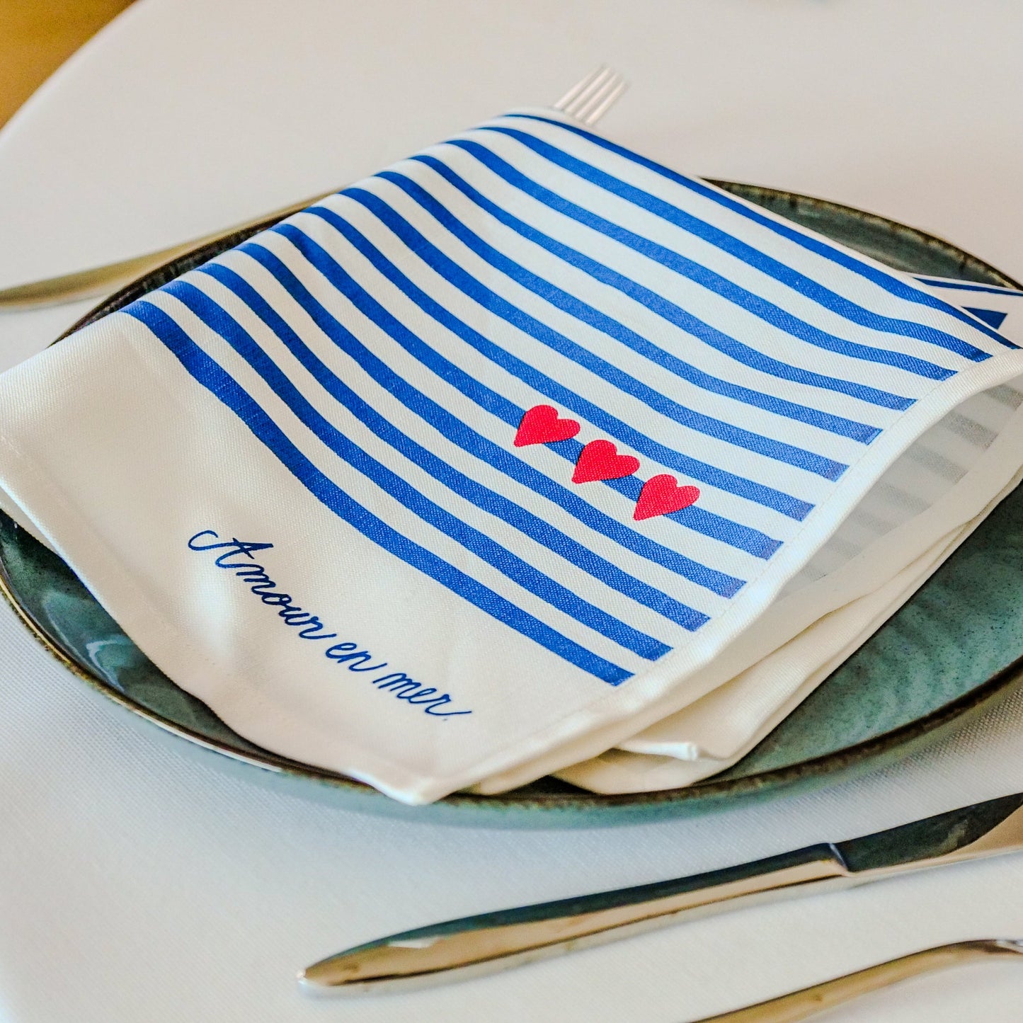 La serviette de table à l'unité "Amour en mer"